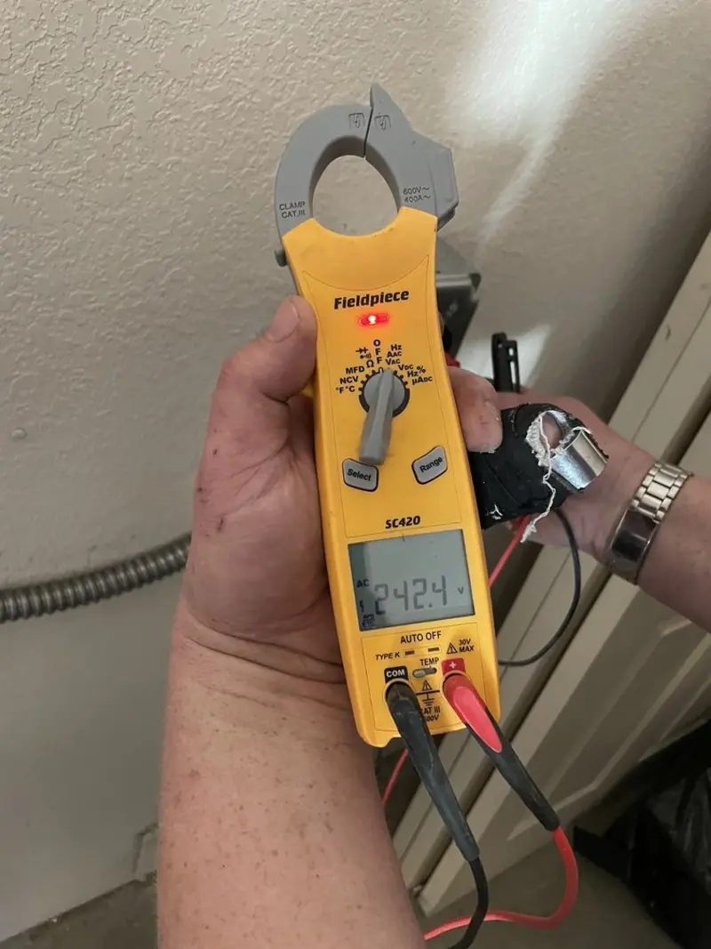 Voltage testing with clamp meter during Outlet Installation in Santa Rosa